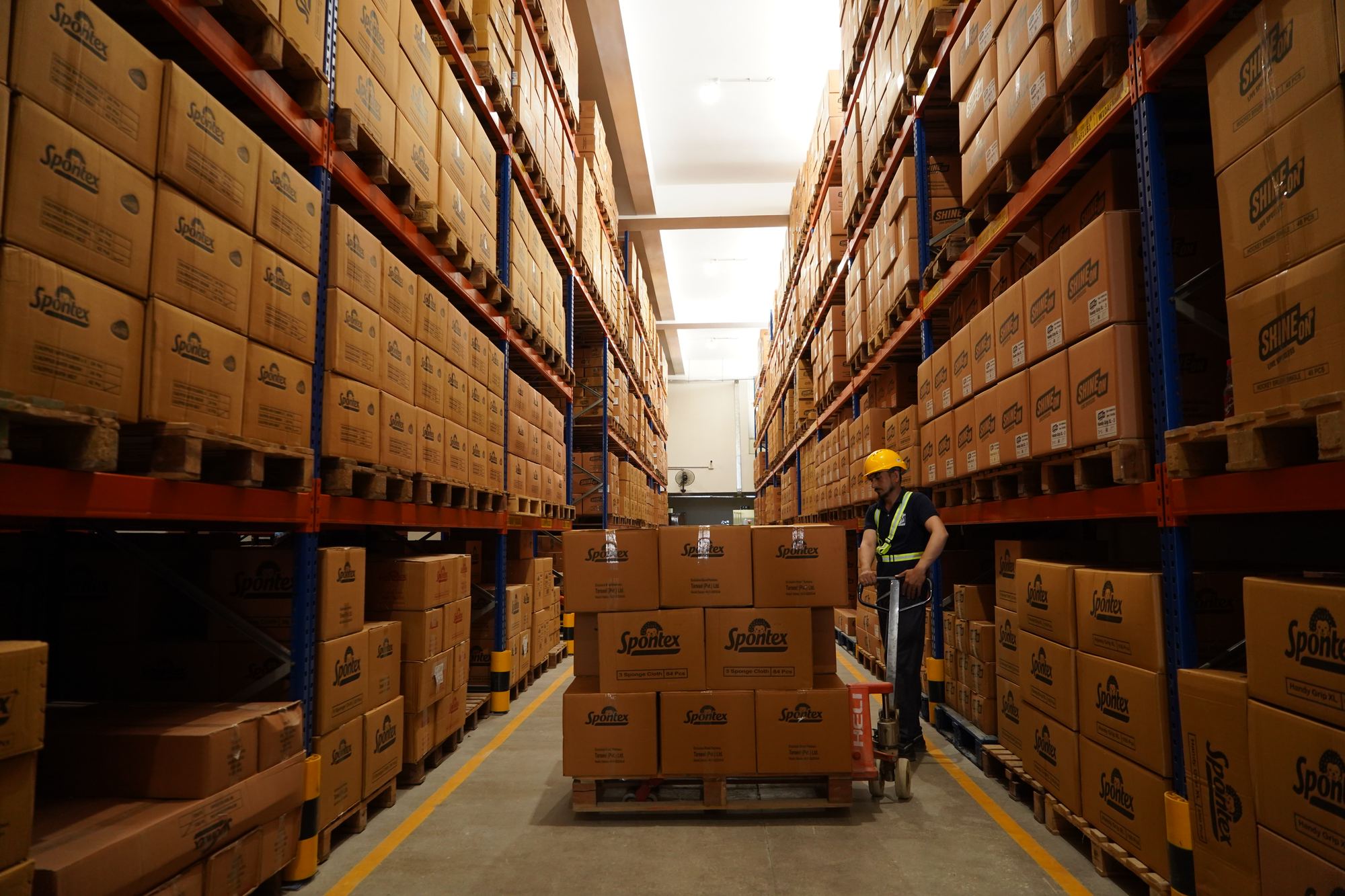 Stocked racking aisle at Tarseel's KCIP warehouse
